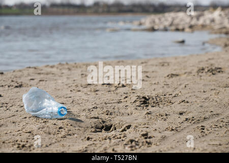 used plastic bottle trash on the beach. natural environment pollution danger Stock Photo
