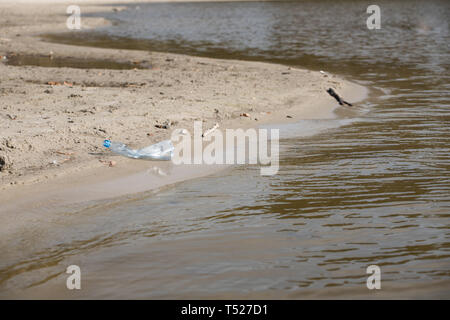 used plastic bottle trash on the beach. natural environment pollution danger Stock Photo