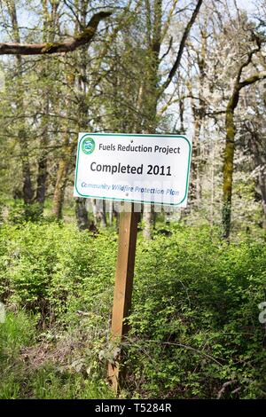 A sign for the Fuels Reduction Project, at the Oregon Garden in Silverton, Oregon, USA. Stock Photo