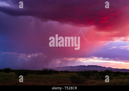 A monsoon storm moves across the desert at sunset near Benson, Arizona, USA Stock Photo