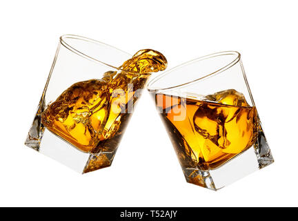 glasses of whiskey making toast Stock Photo