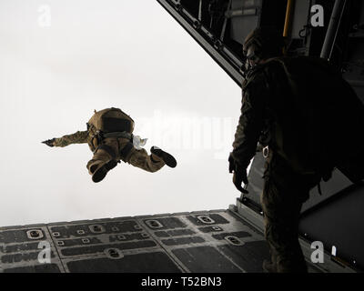 A Special Tactics Operator from the 24th Special Operations Wing jumps out of the back of an MC-130H Combat Talon II, Hurlburt Field, Florida, April 19, 2019. The 24th SOW is the U.S. Air Force’s only Special Tactics wing and U.S. Special Operations Command’s tactical air-to-ground integration force and the Air Force’s special operations ground force to enable global access, precision strike, personnel recovery, and battlefield surgery operations. (U.S. Air Force photo by Staff Sgt. Michelle Di Ciolli) Stock Photo