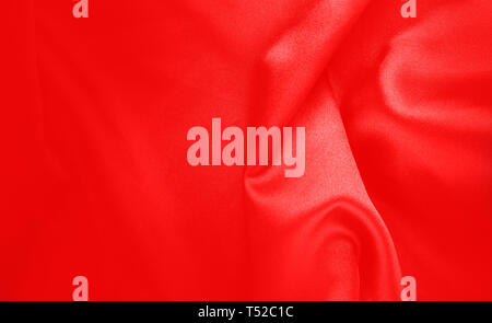 red texture - dark wavy glossy silk drapery. Stock Photo
