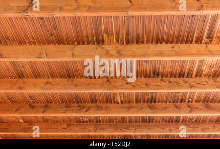 Horizontal background wooden boards and roof beams - Real wood boarding roof with cross beams - Genuine wood boards beams planks texture background pa Stock Photo