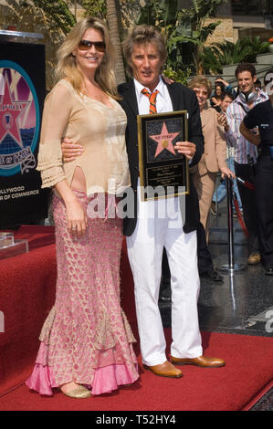 LOS ANGELES, CA. October 11, 2005: Pop star ROD STEWART & girlfriend PENNY LANCASTER on Hollywood Boulevard where he was honored with the 2,293rd star on the Hollywood Walk of Fame. Penny is expecting Rod's fifth child in November. © 2005 Paul Smith / Featureflash Stock Photo