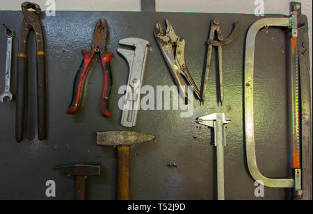 Restored and painted an antique monkey wrench on a metal background Stock Photo