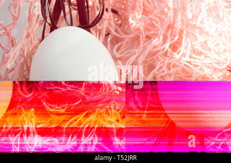 Shooting Easter, one egg on a pink background - damaged file. Abstract texture background noise Glitch camera VHS pixel error. For use in the modern f Stock Photo