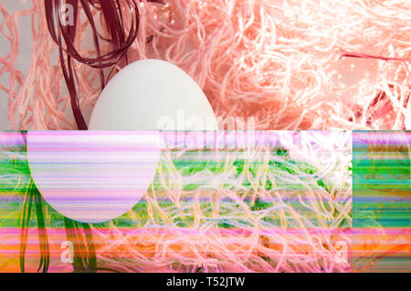 Shooting Easter, one egg on a pink background - damaged file. Abstract texture background noise Glitch camera VHS pixel error. For use in the modern f Stock Photo