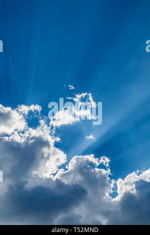 blue sky, clouds and sun rays Stock Photo