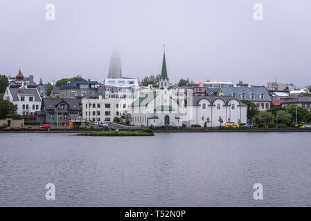 Tjornin Lake in Reykjavik, view with Frikirkjan - Free Church and National Gallery of Iceland Stock Photo