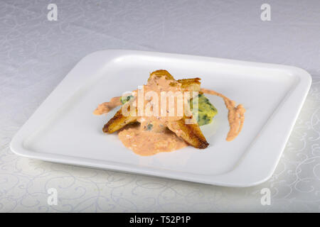 Seabass in shrimp sauce Stock Photo