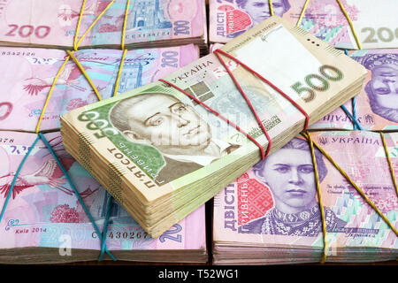 Stacks of Ukrainian hryvnia UAH banknotes. The money of Ukraine. Stock Photo