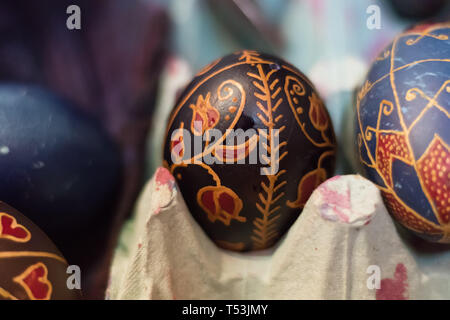 Egg decoration with a specific tool, handmade by hungarians. It is called writing easter eggs, which is making a thin line of bees-wax and then they c Stock Photo