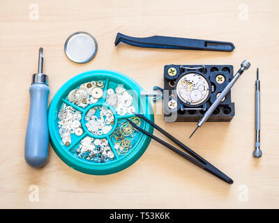top view of watch repairing tools and spare parts on table in workshop Stock Photo