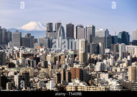 Mountain Fuji with Tokyo skylines and skyscrapers buildings in Shinjuku ward in Tokyo. Taken from Tokyo Bunkyo civic center observatory sky desk. Stock Photo