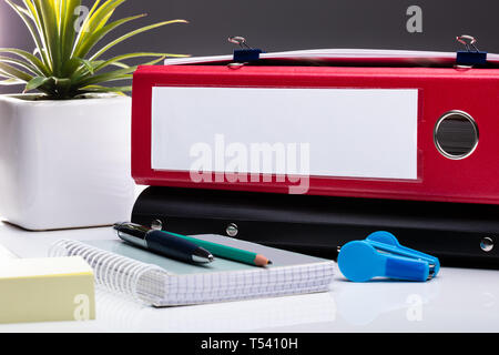 Office Workplace With Laptop And Folders On White Table Stock Photo