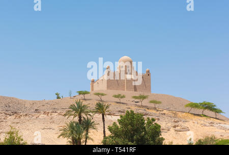 View from Nile river of Aga Khan mausoleum tomb on hill top in Aswan Egypt Stock Photo