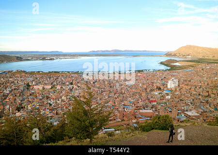 Female Looking at Lake Titicaca from the Condor Hill View Point in Puno, Peru, South America Stock Photo