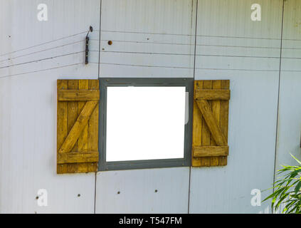 open window frame cut out and isolated with white, classical window with wooden shutters Stock Photo