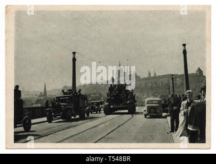 Red Army tanks on the Mánes Bridge (Mánesův most) in Prague, Czechoslovakia, on 9 May 1945. Black and white photograph by an unknown photographer taken in May 1945 and issued in the Czechoslovak vintage postcard in 1945. Courtesy of the Azoor Postcard Collection. Stock Photo