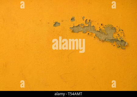 Old Peeling Yellow Paint from a Cuban Building Stock Photo