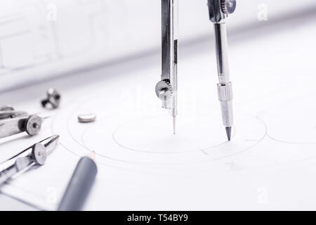 Compasses and several drawing tools available in the drawings. Design and working drawings with pencils, rule and compasses. selective focus Stock Photo