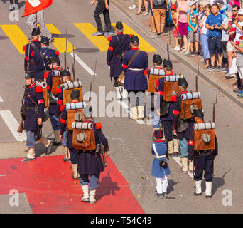 Zurich, Switzerland - August 1, 2018: participants of the parade devoted to the Swiss National Day passing Uraniastrasse street in the city of Zurich. Stock Photo