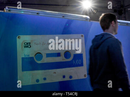 Berlin, Germany. 10th Apr, 2019. A young man walks through the exhibition 'Nineties Berlin' in the Alte Münze. Credit: Britta Pedersen/dpa-Zentralbild/dpa/Alamy Live News Stock Photo