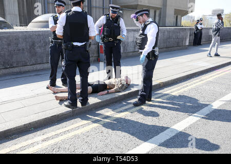 London, UK. 20th April, 2019. Waterloo Bridge, London. Environmental campaign group Extinction Rebellion being cleared of protesters on Waterloo Bridge. Credit: Penelope Barritt/Alamy Live News Stock Photo