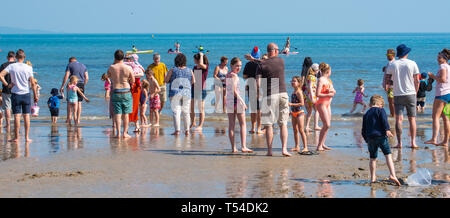 Lyme Regis, Dorset, UK. 20th April 2019. UK Weather: Holiday makers and beachgoers pack the ...