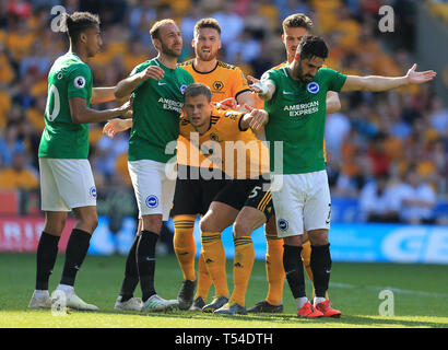 Wolverhampton, UK. 20th Apr, 2019. Brighton and Hove Albion and Wolverhampton Wanderers players tustle at a corner Credit: Paul Roberts/OneUpTop/Alamy Live News