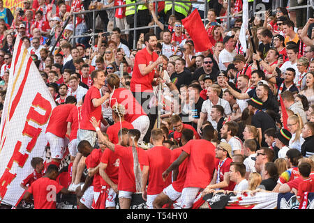 Mainz, Germany. 20th Apr, 2019. Mainz's head coach Sandro Schwarz (Top) and players celebrate avoiding relegation with the fans after a German Bundesliga match between 1.FSV Mainz 05 and Fortuna Duesseldorf in Mainz, Germany, on April 20, 2019. Mainz won 3-1. Credit: Kevin Voigt/Xinhua/Alamy Live News Stock Photo
