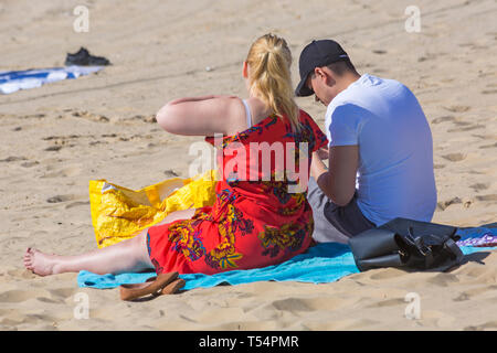 Bournemouth, Dorset, UK. 21st Apr 2019. UK weather: the heatwave continues with hot and sunny weather, as beachgoers head to the seaside to enjoy the heat and sunshine at Bournemouth beaches for the Easter holidays - mid morning and already beaches are getting packed, as sunseekers get there early to get their space. Credit: Carolyn Jenkins/Alamy Live News Stock Photo