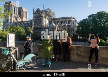 Paris, France. 21st April 2019. Early morning on Easter Sunday at the Notre Dame Cathedral in Paris. The city’s worshippers were relocated to attend Easter Sunday Mass at the Saint-Eustache church following the devastating fire that engulfed large parts of Notre Dame, an 850 year old gothic landmark that sits on the Île de la Cité in the centre of Paris. The area has been largely cordoned off by police, following the fire on 15th April 2019, and French president Emmanuel Macron has pledged to restore the national treasure within five years, despite many experts saying it will take longer. Stock Photo