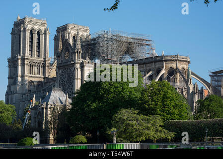 Paris, France. 21st April 2019. Early morning on Easter Sunday at the Notre Dame Cathedral in Paris. The city’s worshippers were relocated to attend Easter Sunday Mass at the Saint-Eustache church following the devastating fire that engulfed large parts of Notre Dame, an 850 year old gothic landmark that sits on the Île de la Cité in the centre of Paris. The area has been largely cordoned off by police, following the fire on 15th April 2019, and French president Emmanuel Macron has pledged to restore the national treasure within five years, despite many experts saying it will take longer. Stock Photo