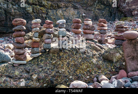 Dunbar, East Lothian, Scotland, UK. 21st Apr 2019. European stone stacking championship:  Balanced stones by Jonathon Kitching, from Scotland, in the artistic competition, giving competitors 3 hours to create anything from stones or found objects at Eye Cave beach Stock Photo
