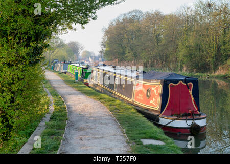 Canal boats on the oxford canal in the early morning spring sunlight. Shipton on cherwell, Oxfordshire, England Stock Photo