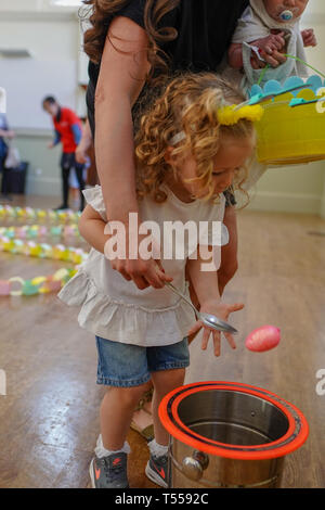 A child playing an egg and spoon game during an Easter egg hunt at Shoreditch Town Hall in London. Photo date: Saturday, April 20, 2019. Photo: Roger  Stock Photo