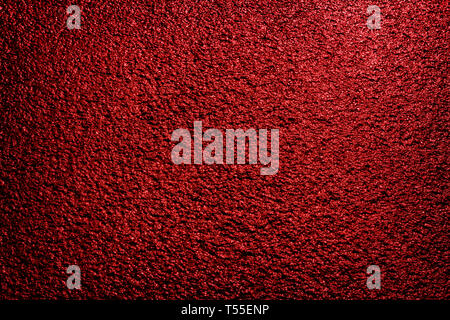 red colored dark asphalt background illuminated by street lamps Stock Photo