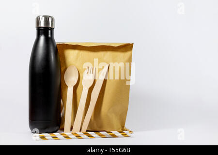 Reusable stainless steel water bottle, paper straws and biodegradable, recyclable utensils and packaging. Plastic single use alternatives Stock Photo
