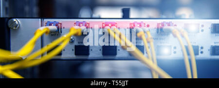 Technology banner. Close up fiber optic cable. Servers racks. Severs computer in a rack at the large data center. Photo contains noise Stock Photo