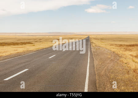 asphalt road Sainshand Zamiin-Uud in Mongolia, beautiful landscape Gobi Desert, Mongolia Stock Photo
