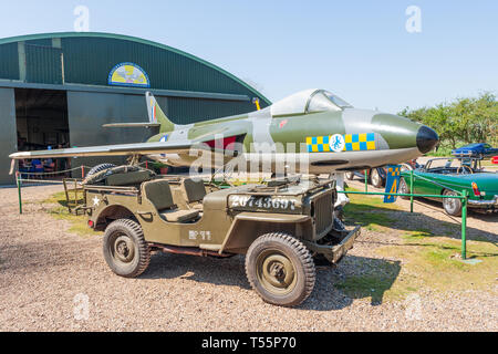 Hawker Hunter fighter aircraft willys jeep and mg midget at flixton aviation museum suffolk uk Stock Photo