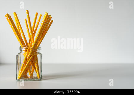Yellow paper straws isolated on white background Stock Photo