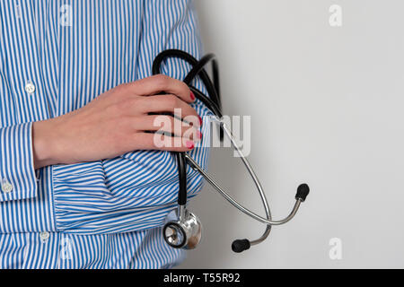 Doctor holding stethoscope Stock Photo