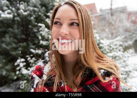 Portrait of young woman in a snow park drinks tea Stock Photo - Alamy