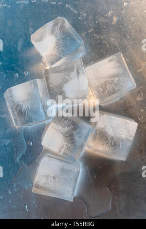 Ice cubes on silver surface Stock Photo