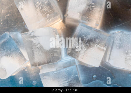 Ice cubes on silver surface Stock Photo