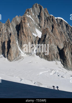 Silhouettes of hikers on Mer de Glace in Mont Blanc massif, France Stock Photo