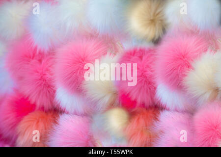 Fluffy multicolored pom-poms Stock Photo
